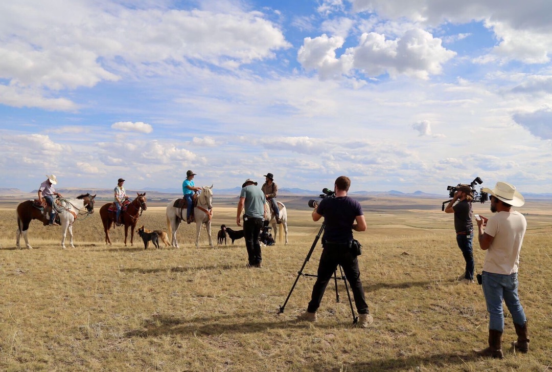 Camera crew filming outdoors